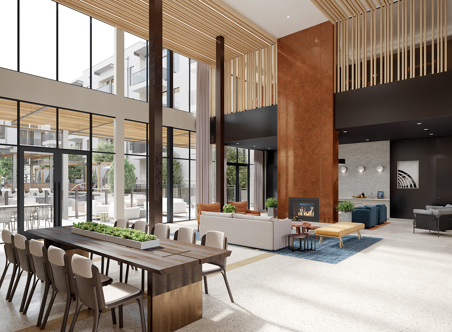 Ferro two-story lobby with fireplace, seating and communal table